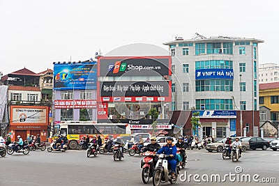 Hanoi, Vietnam - Mar 15, 2015: Hanoi street traffic at intersection Xa Dan - Ton Duc Thang - Tay Son street. A lot of motorcycles Editorial Stock Photo