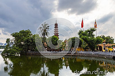 Hanoi, Vietnam - May 28, 2023: The Tran Quoc Pagoda, situated on a small island in Hanoi's West Lake, is an ancient Buddhist Editorial Stock Photo