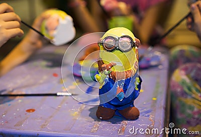 Hanoi, Vietnam - Nov 2, 2014: Minion, famous character from animation movie Despicable Me, made from plaster, and painted by child Editorial Stock Photo