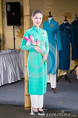 Hanoi, Vietnam - Oct 15, 2016: Vietnam Airlines air hostess mannequin wearing uniform at Ao Dai festival on Hoang Dieu street Editorial Stock Photo