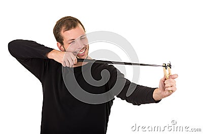 Hansome man concentrated aiming a slingshot Stock Photo