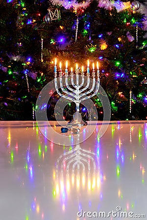 Hanukkah celebrates with menorah burning with nine candles. Stock Photo