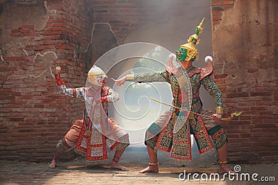 Hanuman monkey god fighting Thotsakan giant in Khon or Traditional Thai Pantomime as a cultural dancing arts performance Stock Photo