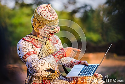 Hanuman playing with laptop Editorial Stock Photo