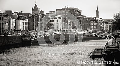 Hapenny bridge over the Liffey River in Dublin Editorial Stock Photo
