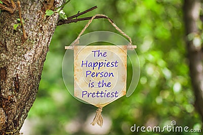 The happiest person is the prettiest on Paper Scroll Stock Photo