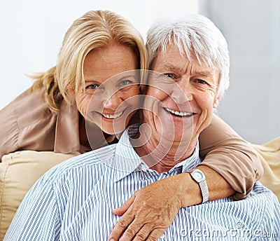 Happily ever afters happens in real life too. Portrait of a wife hugging her husband affectionately. Stock Photo