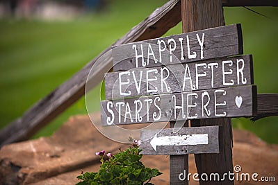 Happily Ever After Starts Here sign at wedding venue Stock Photo