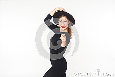Happiness beautiful woman in hat, black overall pointing at came Stock Photo