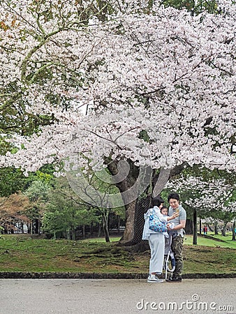 Happiness of a Japanese family in Nara Park. Editorial Stock Photo