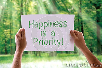 Happiness is a Priority card with nature background Stock Photo