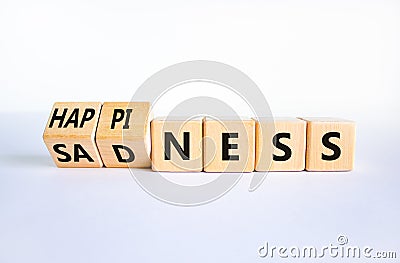 Happiness or sadness symbol. Turned cubes and changed the word `sadness` to `happiness`. Beautiful white background. Business, Stock Photo