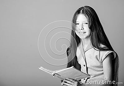 Happiness. small girl read interesting story. fiction book. keep her secrets in diary. book store concept. novel for Stock Photo