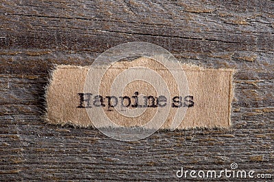 Happiness -word typed on a piece of paper, motivation concept to move on to find your personal blessing Stock Photo
