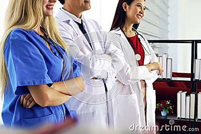 Happiness teamwork doctor talking and discuss about solution solve corona virus at clinic room. Stock Photo