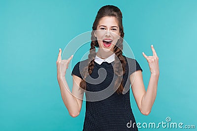 Happiness young woman showing rock and roll sign. Stock Photo