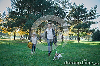 Happy abstract: mother and daughter run in city park Stock Photo