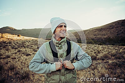 Happy active male teen hiking in mountain enjoying fresh air Stock Photo