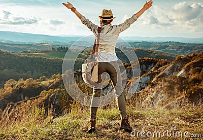 Happy active solo traveller woman rejoicing Stock Photo