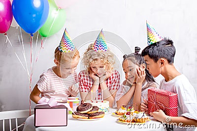 Happy adorable kids are going to eat cake Stock Photo