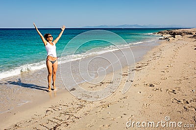 Happy adult woman enjoing about holiday spent on the sea beach Stock Photo