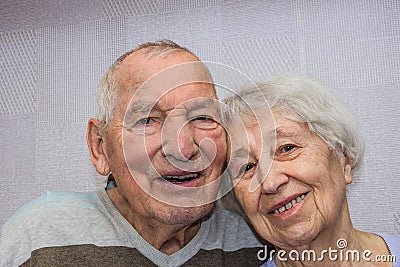 Happy affectionate mature old man and woman embracing Stock Photo