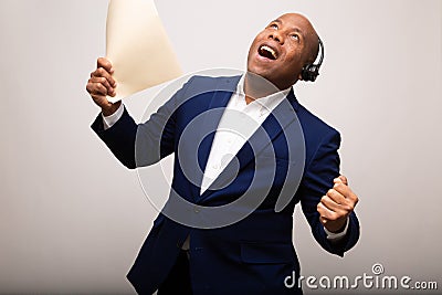 Happy African American Businessman Holds Up File Stock Photo