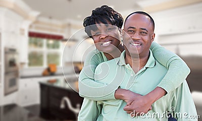 Happy African American Couple Inside Beautiful Custom Kitchen. Stock Photo