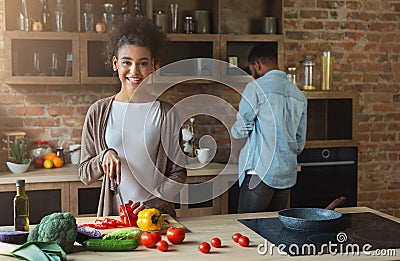 Happy african-american family cooking in loft kitchen Stock Photo