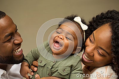 Happy African American family with their baby. Stock Photo