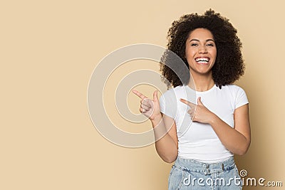 Happy african American girl point at blank copy space Stock Photo