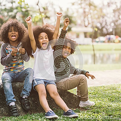 Happy African american little boy kid children joyfully cheerful and laughing. Stock Photo