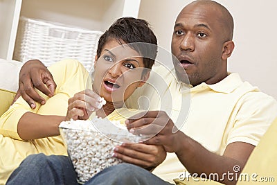 Happy African American Woman Couple Eating Popcorn Stock Photo