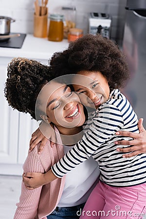 happy african american woman embracing cheerful Stock Photo