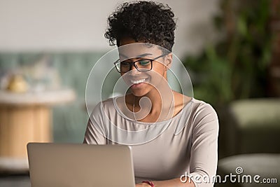 Happy african american woman using laptop work study in office Stock Photo