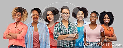 Happy african american women over grey background Stock Photo