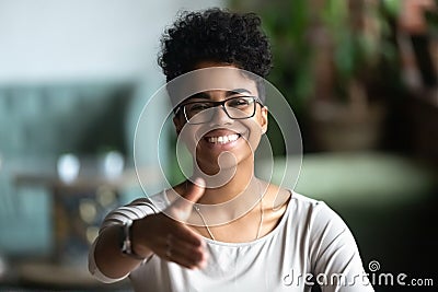 Smiling biracial young woman greeting introducing at meeting Stock Photo