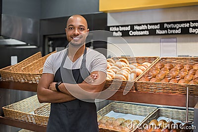 Happy african baker man Stock Photo