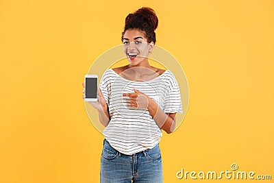 Happy african lady showing smartphone with blank screen isolated Stock Photo