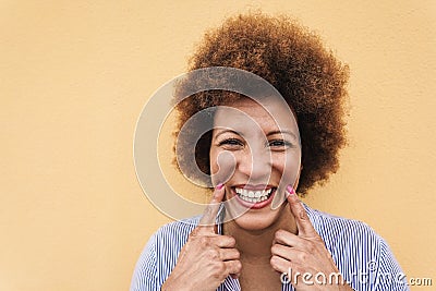 Happy african senior woman smilng on camera outdoor - Focus on face Stock Photo