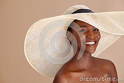 Happy african woman wearing straw hat with a wide brim Stock Photo