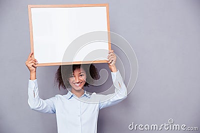 Happy afro american woman holding blank board Stock Photo