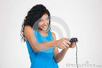 Happy afro american woman playing in video game with joystick Stock Photo