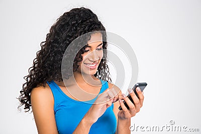 Happy afro american woman using smartphone Stock Photo
