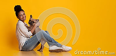 Happy Afro Woman Dog Owner With Her Cute French Bulldog Puppy Stock Photo