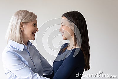 Happy aged mother meeting daughter after long time apart Stock Photo