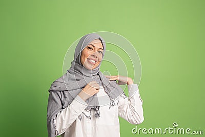 Happy arab woman in hijab. Portrait of smiling girl, posing at studio background Stock Photo