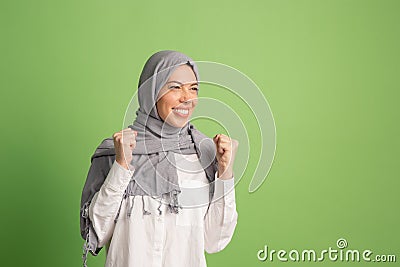 Happy arab woman in hijab. Portrait of smiling girl, posing at studio background Stock Photo