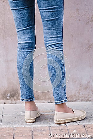 Happy Asia woman in bright blue skinny crop jeans, sky blue jeans Stock Photo