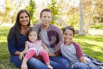 Happy Asian Caucasian mixed race family, portrait in a park Stock Photo